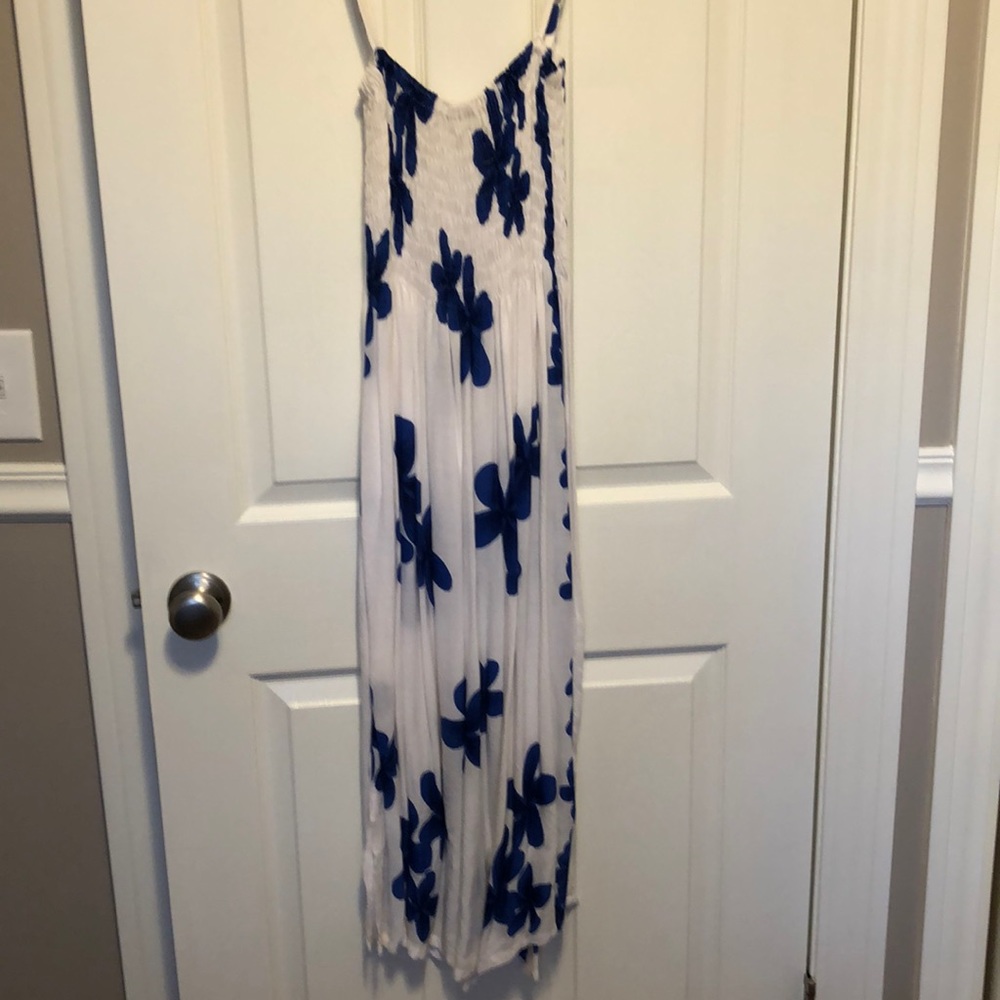 Long white dress with blue flowers.